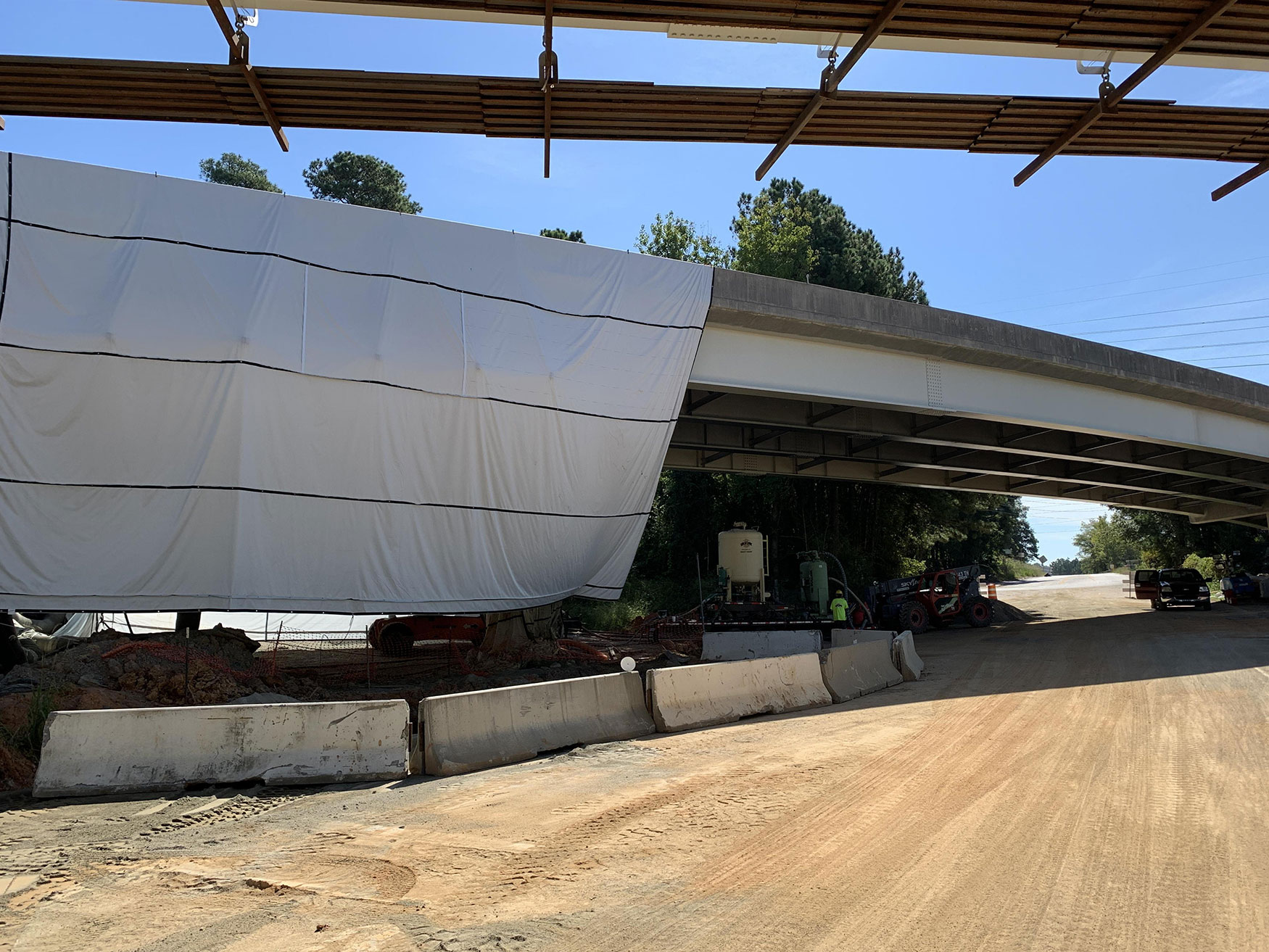 Here the existing Colonial Life Boulevard bridge being painted to protect it from corrosion and extend its lifespan.