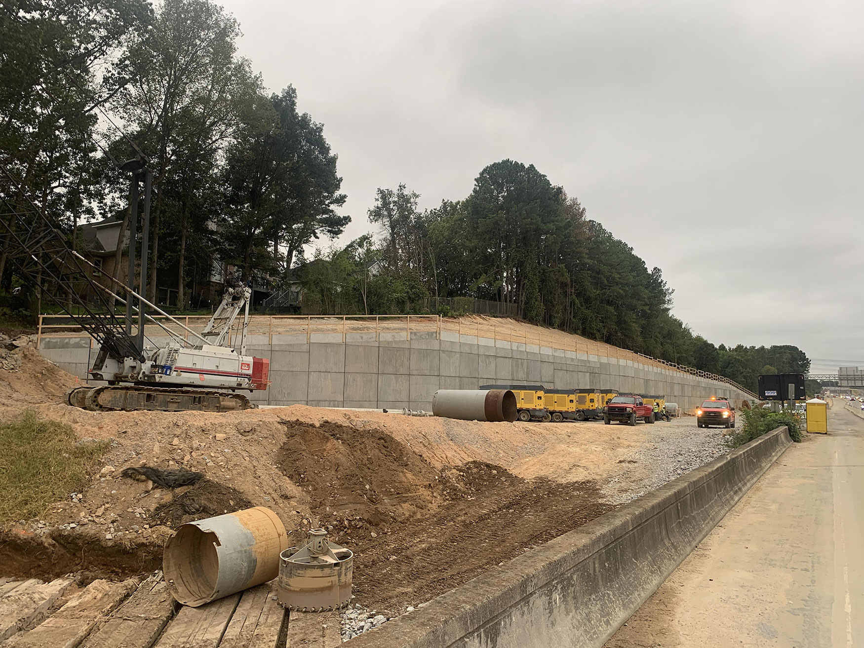 A Gravix wall is a retaining all that provides essential stability and support in infrastructure projects. This photo shows a completed Gravix wall along I-26.