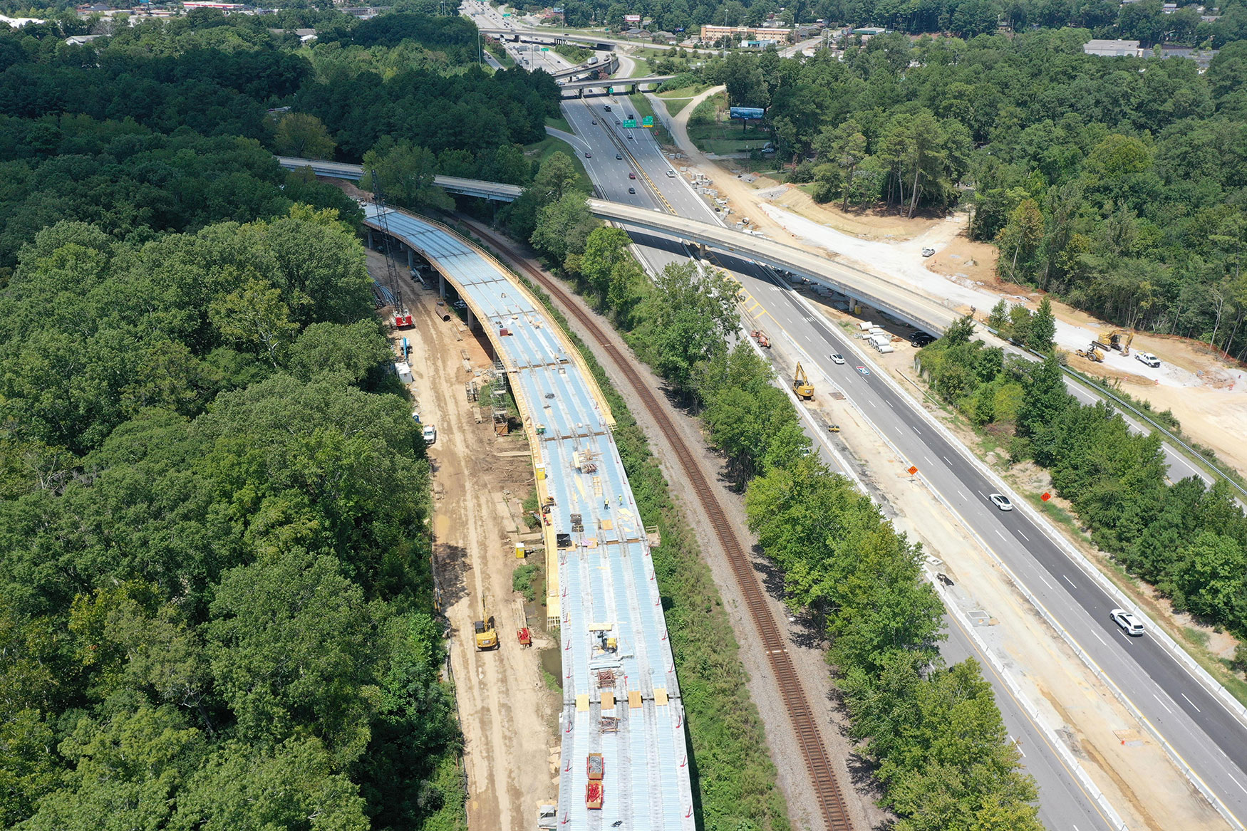 Stay-in-place or "SIP" forms are being installed on a new bridge from I-26 westbound to I-126 eastbound. SIP forms are usually made of corrugated galvanized metal and support concrete during placement for bridge decks.