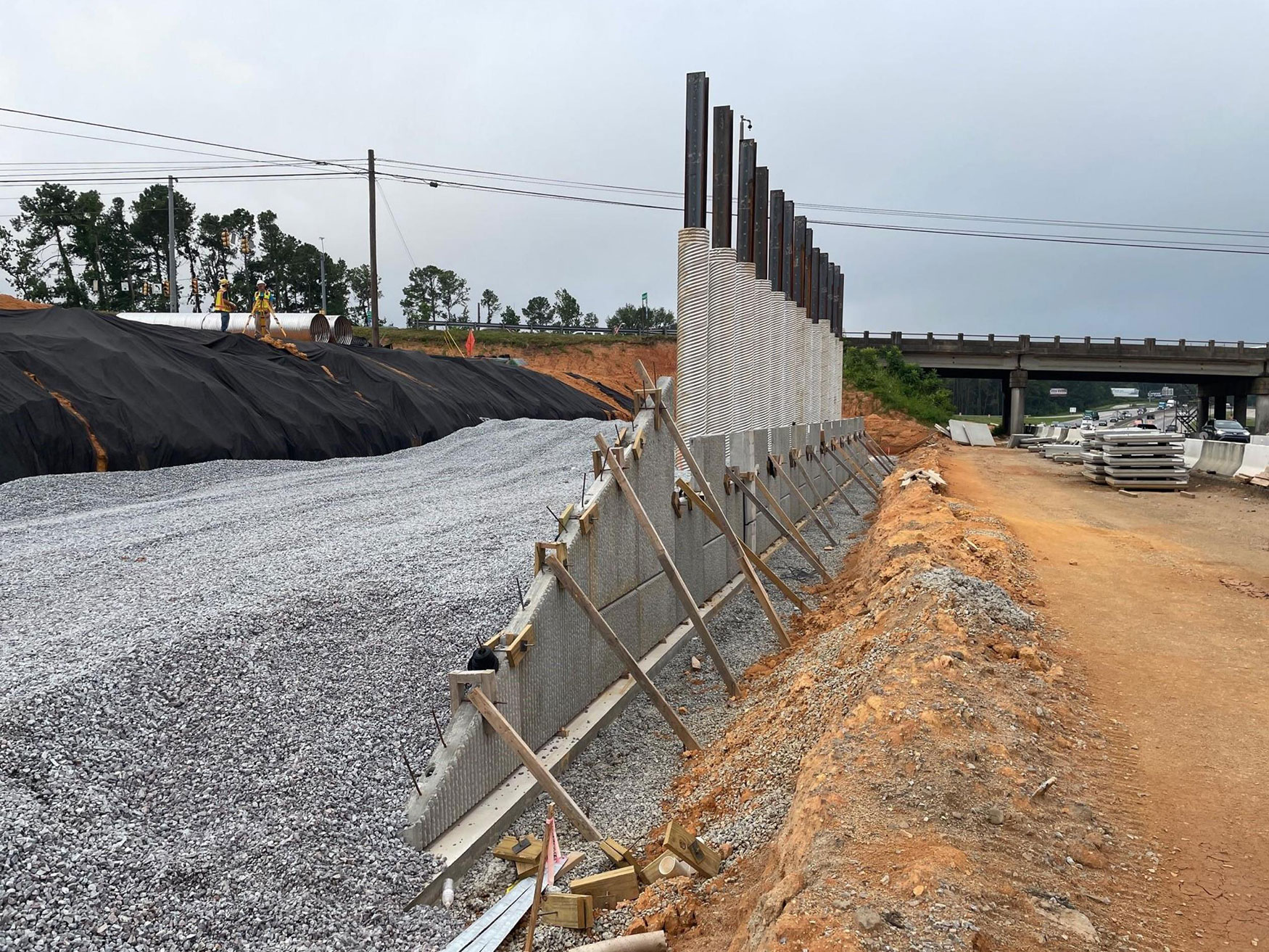 July 2023 crews began installing retaining walls along I-20.  